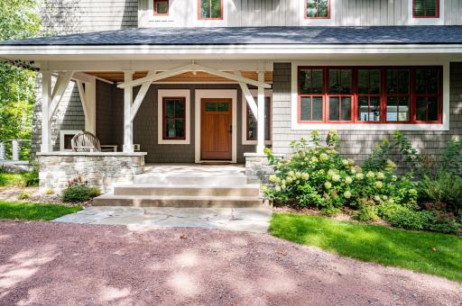 Beautiful front Entry...enjoy your morning coffee and take in the woods and beautiful landscaping