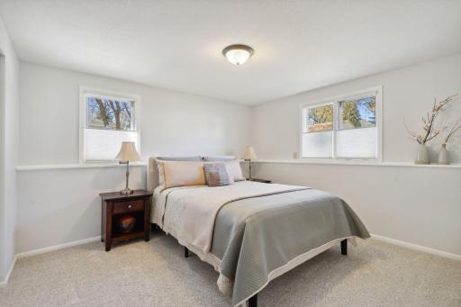 Lower level bedroom has 2 full size windows for ample daylight. Works well as a bedroom or office.
