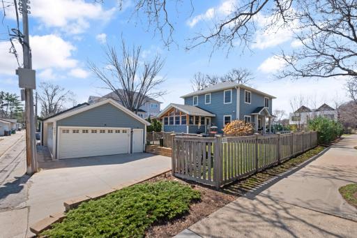 Sprawling lot provides a fully fenced back yard section with patio space for entertaining