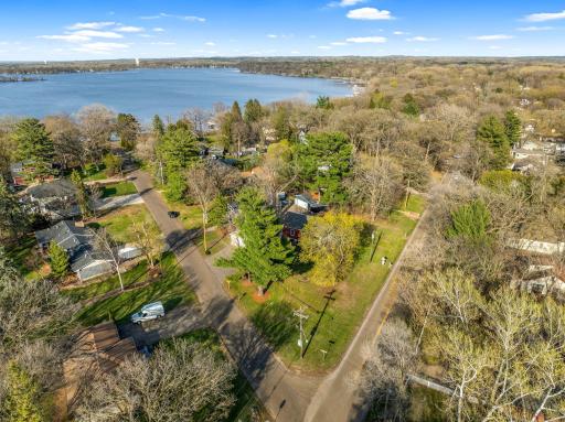 Drone photo shows the home/lake from above and you'll love the location even better from on-site!