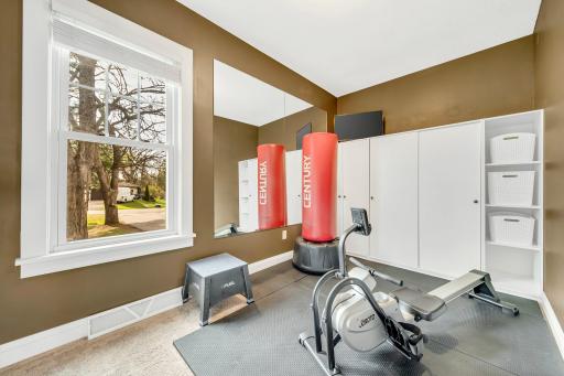 2nd bedroom on main level is currently being used as exercise room. Cabinets will stay,