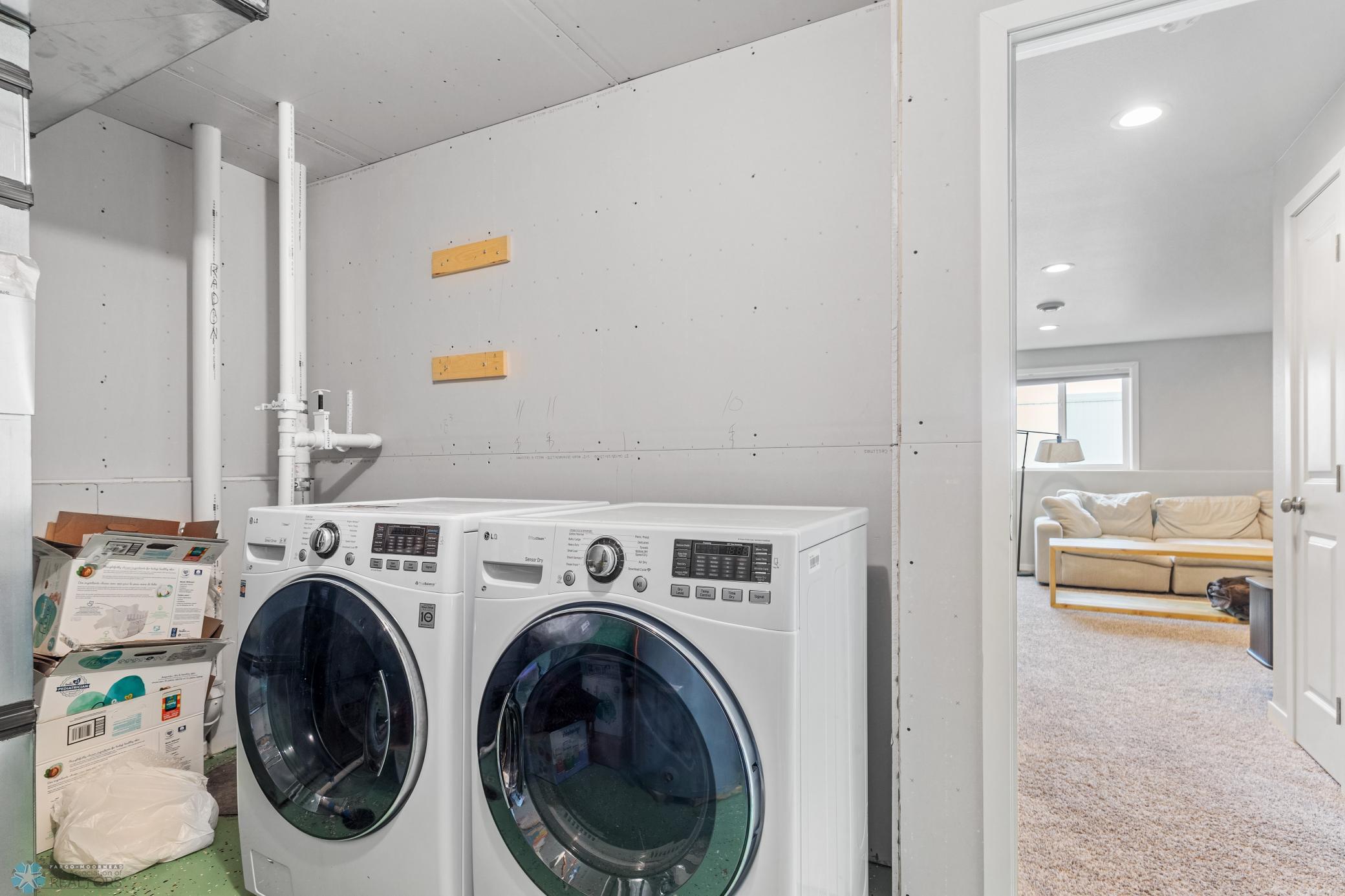 Laundry/Utility Room with epoxy flooring