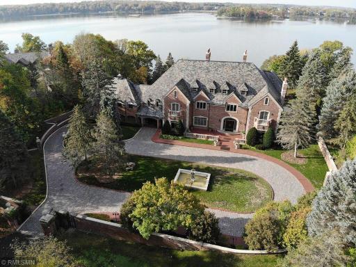 “Hawk's Nest” is a true Lake Minnetonka landmark! This beautiful custom estate, inspired by a 1789 English manor, built in 1989, has a rich history and extensive updates.