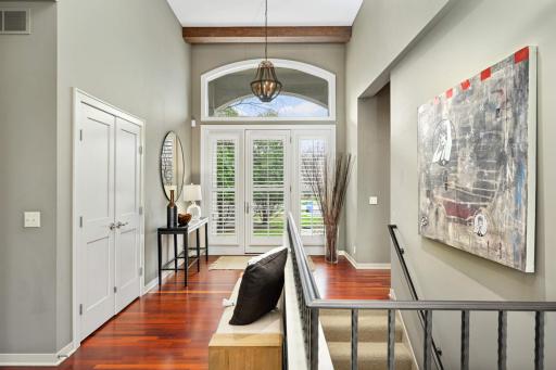 Custom plantation shutters across three-wide door and large closet.