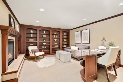 Ideal Office with fireplace, built-in Cherry shelving, and granite custom desk