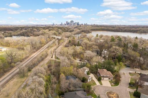 East facing view above home showing the Cedar Lake Regional Trail, Cedar Lake, Brownie Lake, and Downtown Mpls!