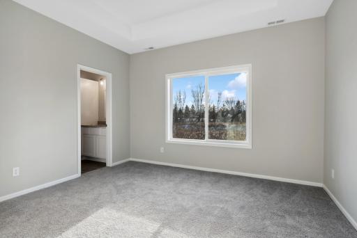 Spacious owner's suite with tray celing. Well designed with large walk-in closet and stunning ensuite. Photo of 4831 Education.