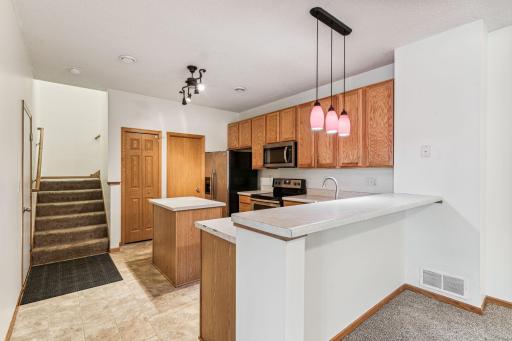 Enjoy the tiered counters that create a breakfast nook at 47 River Woods.