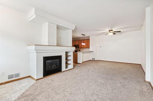 Enjoy the gas fireplace with custom built-ins at 47 River Woods.