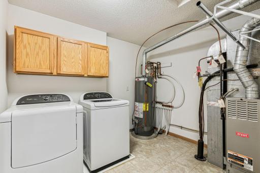 47 River Woods has an upstairs laundry with a newer water heater.