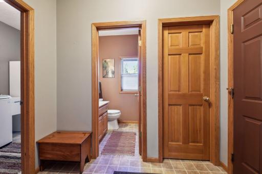 Mudroom w/ 1/2 bathroom and walk-in closet offers awesome storage.