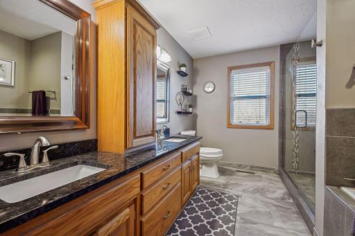 Your luxury bathroom awaits. Great vanity storage, double sinks. Tiled floors and shower.