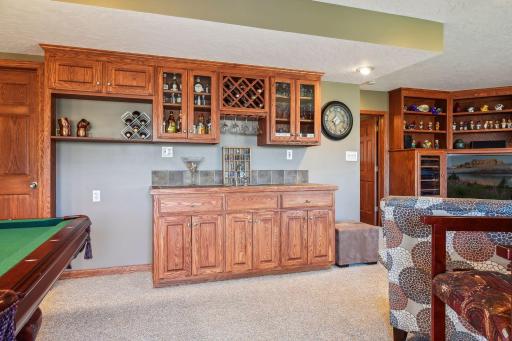 You'll love all this extra storage and custom built-in with wet bar! All that is left to plan is the housewarming party!