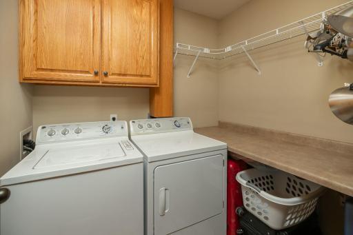 Laundry with cabinets and folding counter