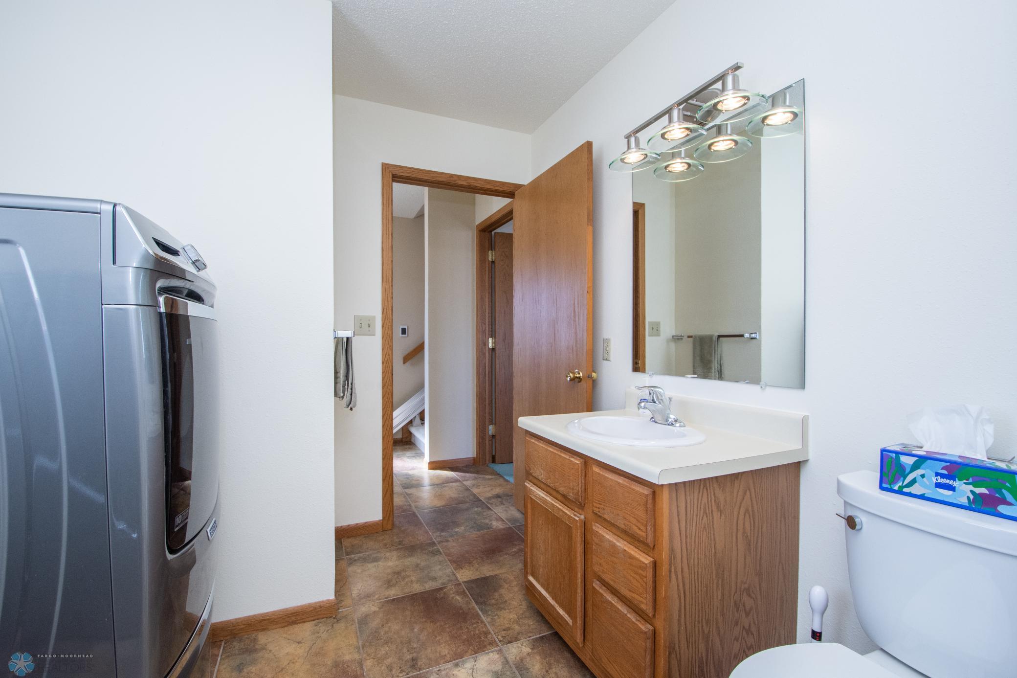 main floor 3/4 bathroom and laundry-heated tile floors