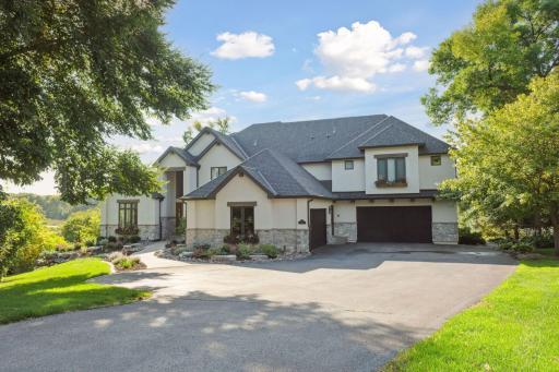 Welcome Home! The stunning curb appeal integrated with nature's beauty create an inviting entrance and the backyard oasis is the real star!
