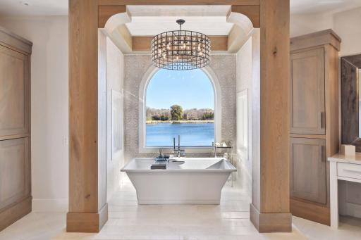 Immerse yourself in serenity in the soaker tub with expansive calming water views.