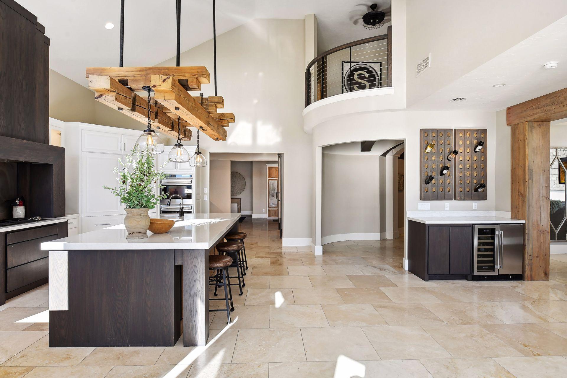 The stunning blend of custom lighting, exposed beams & arches, rich wood and white quartz create a timeless aesthetic.