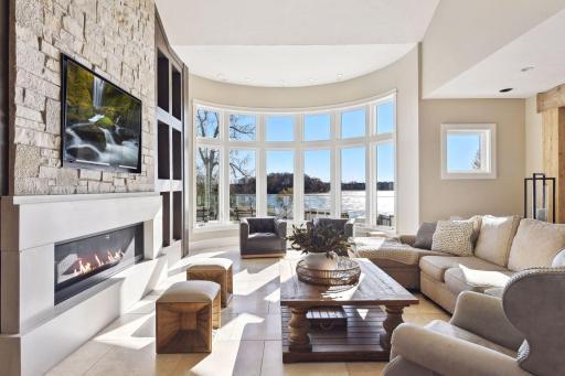 The living room features a wall of windows that frame the breathtaking views.
