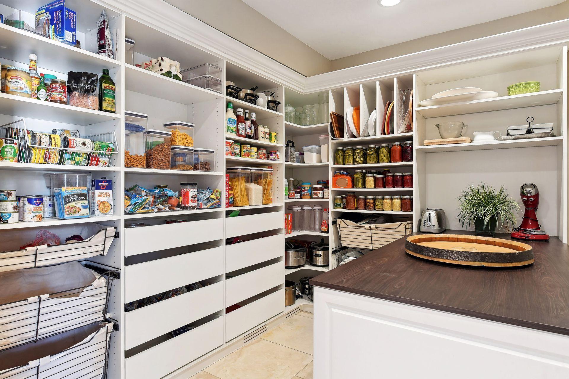 Step into the pantry of your dreams! A spacious and organized haven where everything has it's place. Ample storage and shelving solutions with prep space as well.