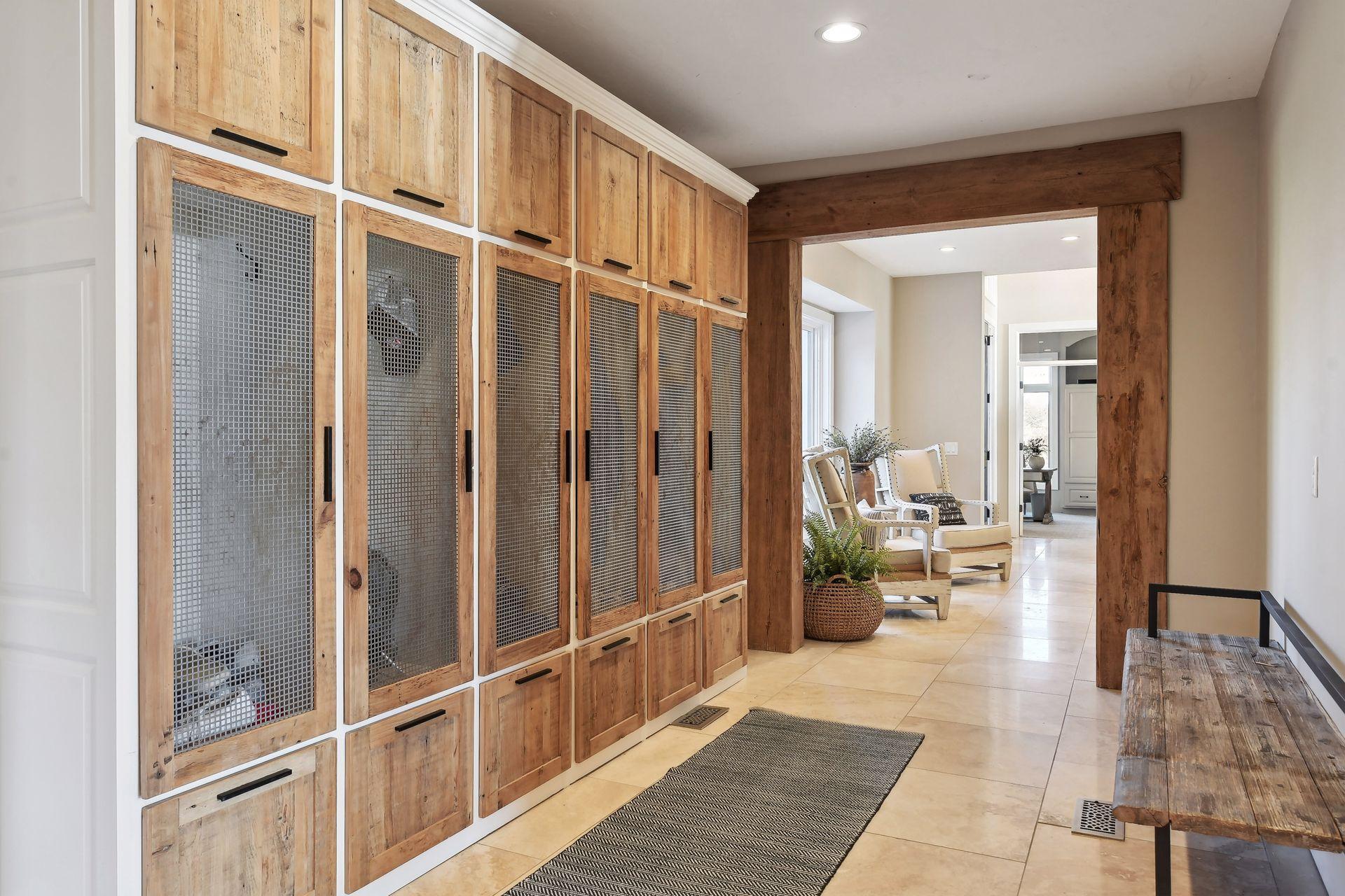 Keep your home organized and clutter free with custom lockers in the mudroom providing desgnated spaces for each family member or guests belongings.