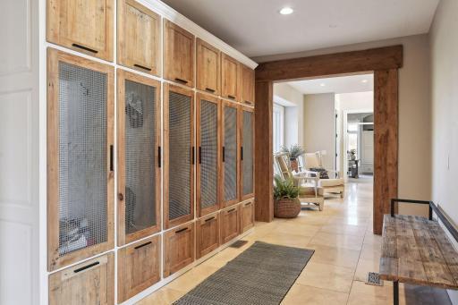 Keep your home organized and clutter free with custom lockers in the mudroom providing desgnated spaces for each family member or guests belongings.
