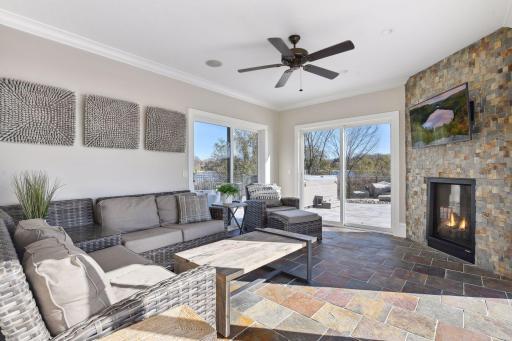 Bask in the natural light and serenity in the sunroom, nestled off the pool area, where you'll enjoy panoramic views and a tranquil atmosphere.