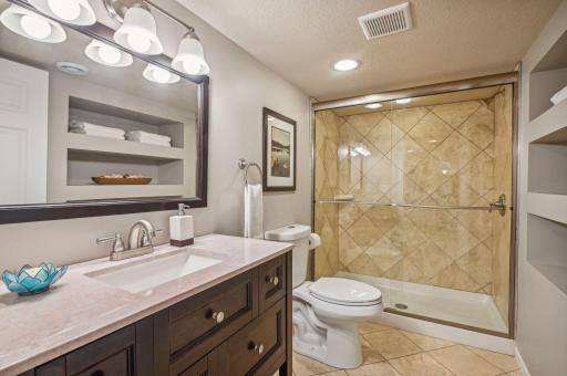Lower level bathroom adjacent to the 4th bedroom---perfect for your guests!