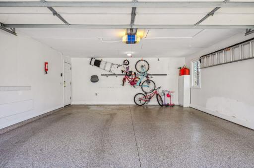 Two-car garage with new epoxy floor and walk-up storage!
