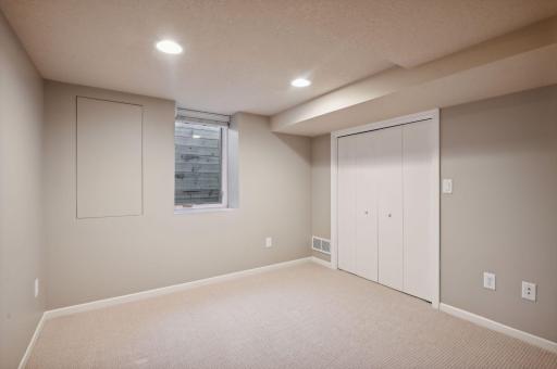 The lower level 4th bedroom is conveniently located next to the 3/4 bathroom.