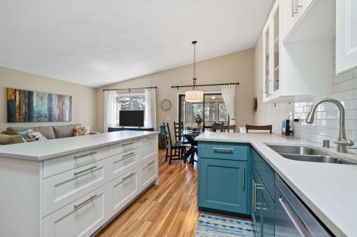 Updated kitchen with ample storage, SS appliances, center island and breakfast bar.