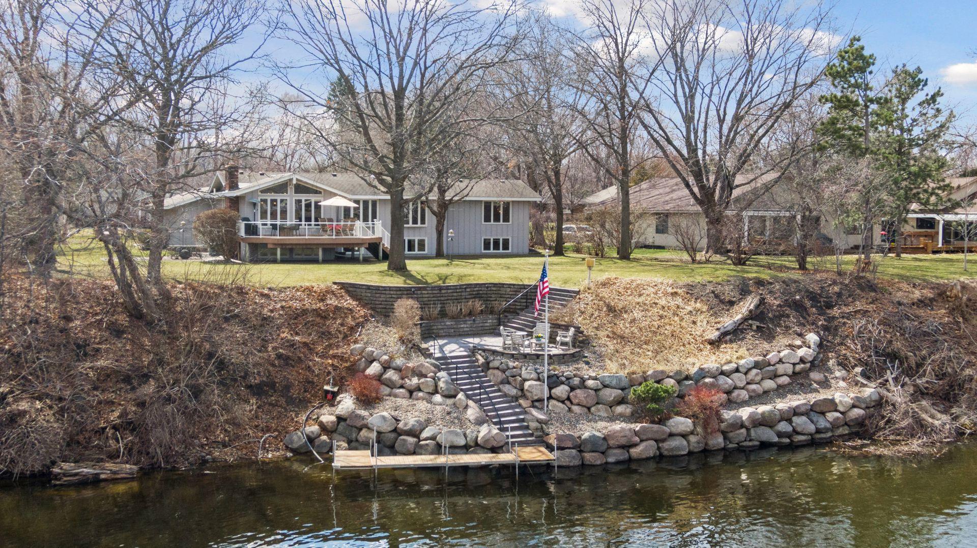 Incredible riverfront property with 142' of prime frontage - located in Champlin!