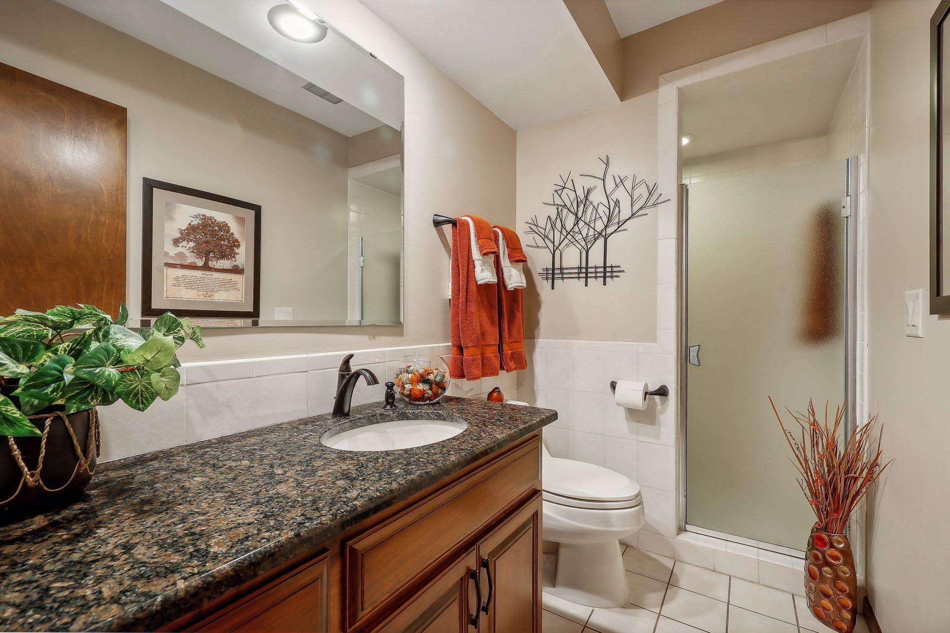 Every bathroom is updated with granite countertops, tiled floors