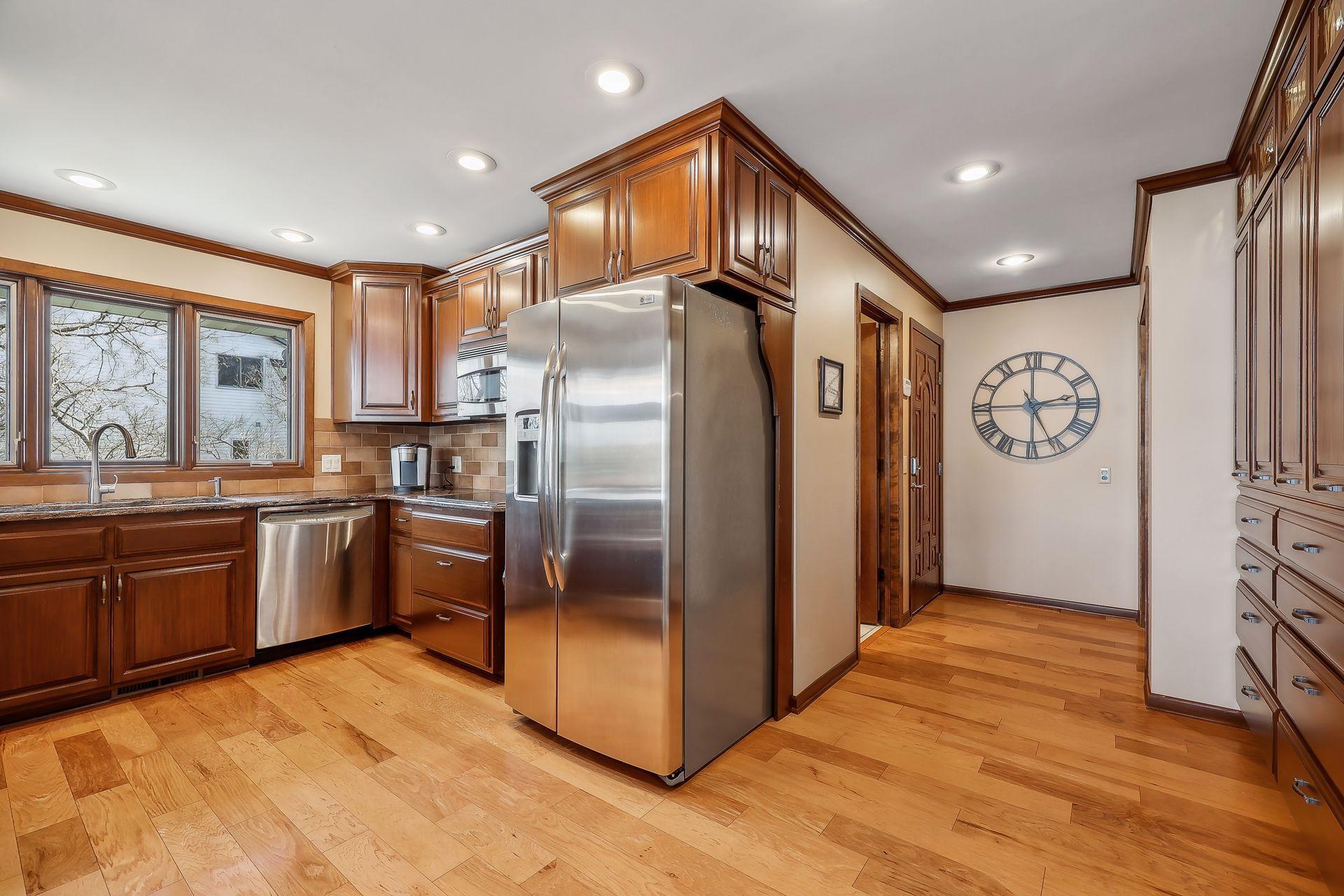 Mudroom offers HWD floors, coat closet and bathroom guest bath access