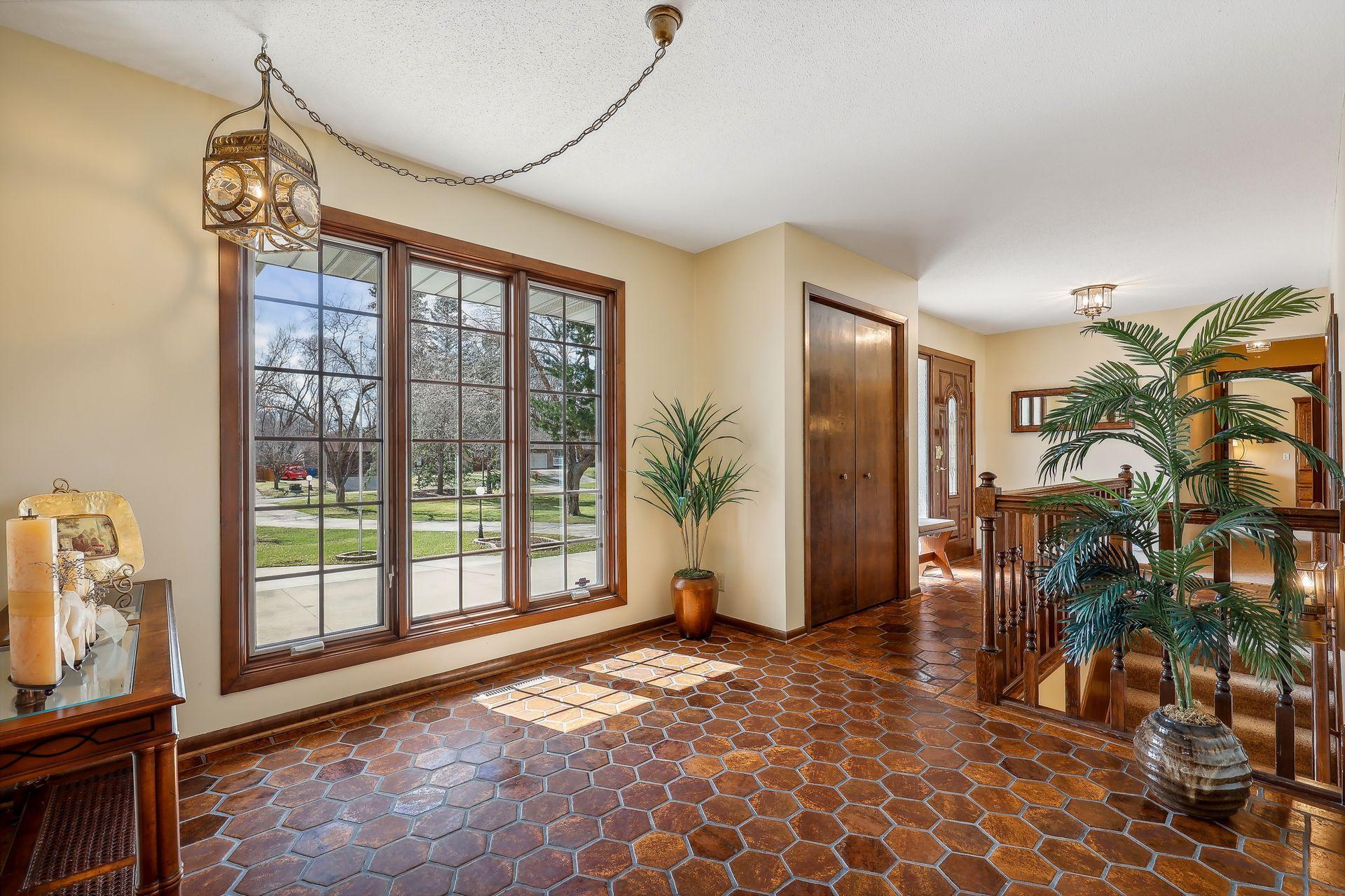 Foyer space offers charm and character, oversized front window, and coat closet