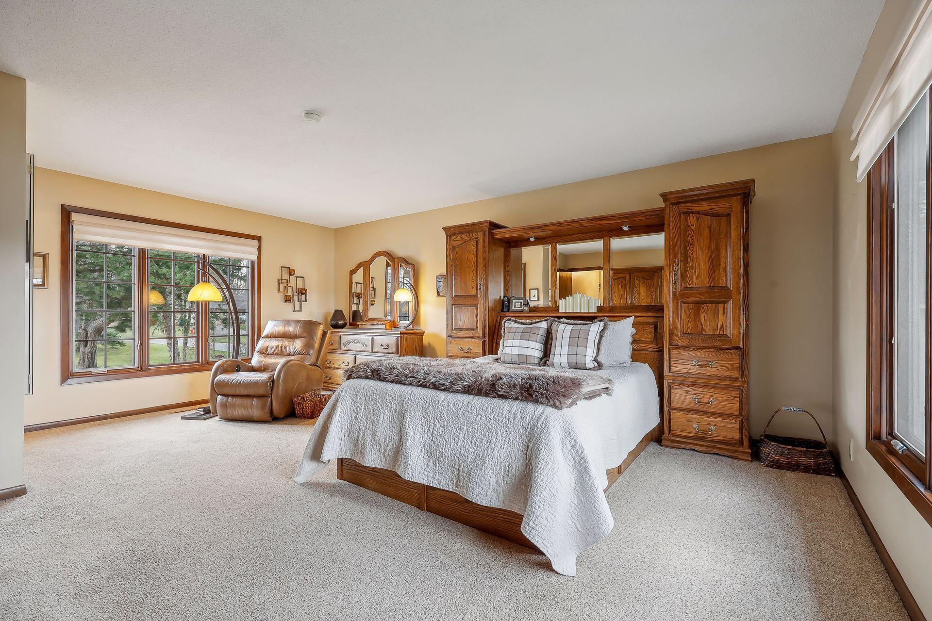 Primary bedroom is spacious enough for sitting area and furniture