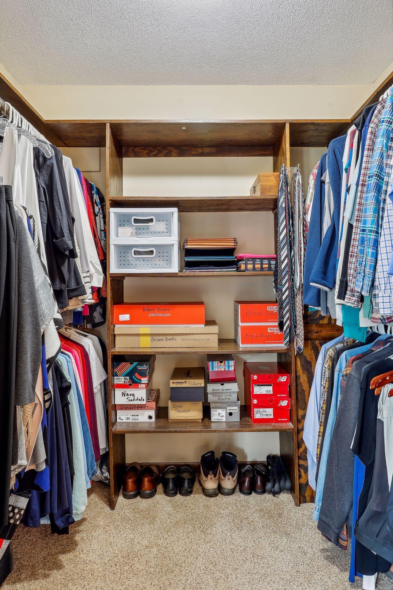This picture doesn't do it justice. This primary bedroom walk-in closet is spacious and ready for you!