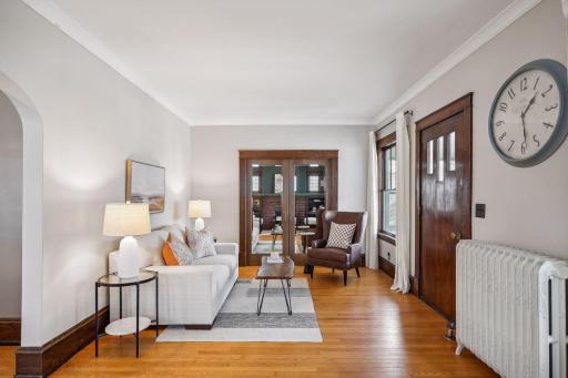Room for a sitting area right when you enter - notice the well-maintained and beautiful hardwood floors and millwork.