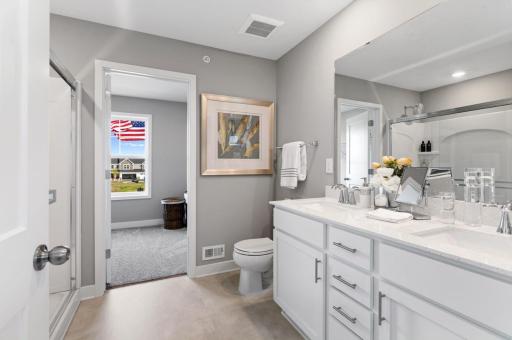 (Photo of a decorated model, actual homes finishes will vary) Another view of the spacious owner's bath.