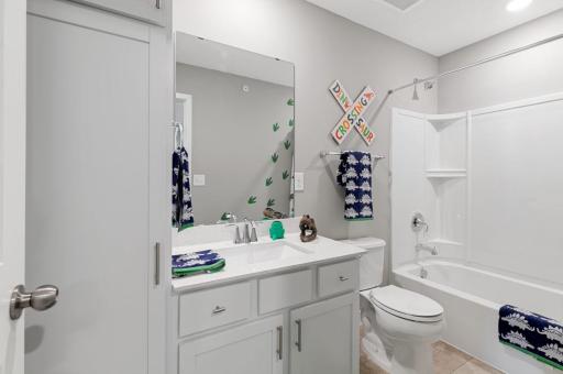 (Photo of a decorated model, actual homes finishes will vary) The upper level secondary bath is sure to provide plenty of space for everyone to get ready in the morning.