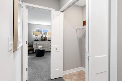 (Photo of a decorated model, actual homes finishes will vary) Centrally located on the upper level, along with the three bedrooms, this laundry room is sure to provide the ultimate convenience.