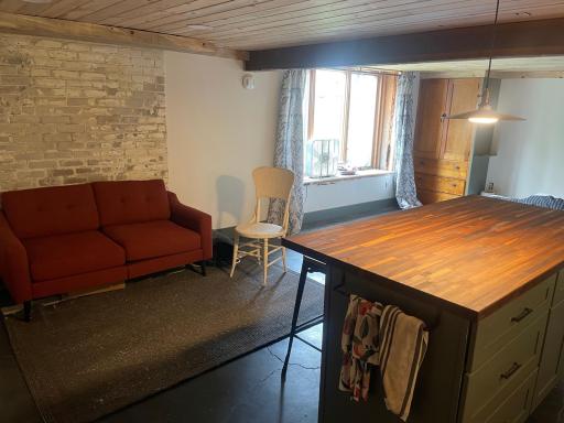 Lower level studio apartment/living area with large south facing egress window. Accessible by side entry, could be rented, or used as an in-law suite.