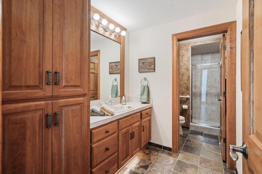 Three-quarter bathroom located in close proximity to the pool.