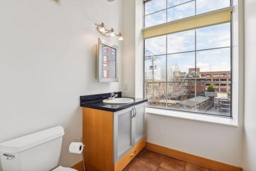 The unit features a separate half bathroom with convenient in-unit laundry facilities.