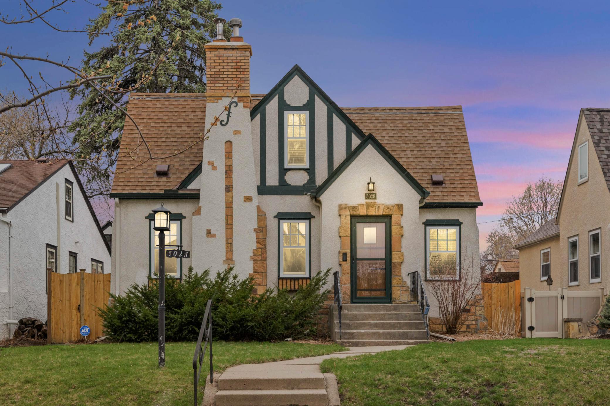 Step into timeless elegance with this charming Tudor nestled in the sought-after Hale neighborhood, steps from the tranquil beauty of Minnehaha Creek.