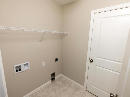Laundry Room. Photo taken of another home. Photos and renderings may not depict actual plan, materials, & finishes may vary. All measurements are approximate.