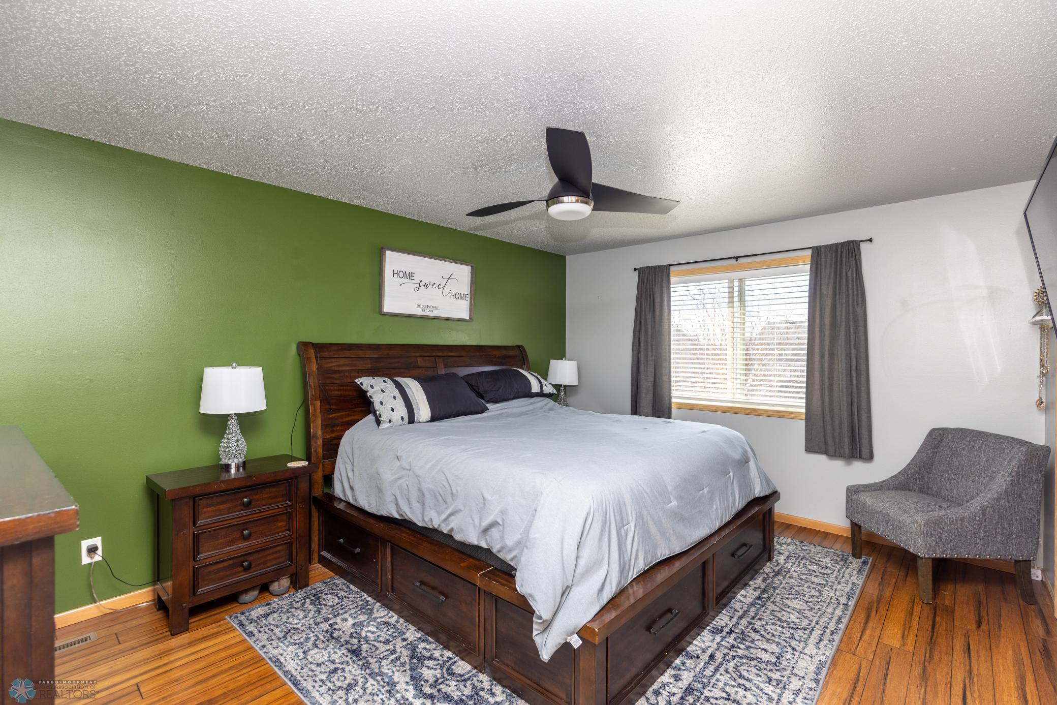 Spacious primary bedroom with walk-in closet. TV mount stays.