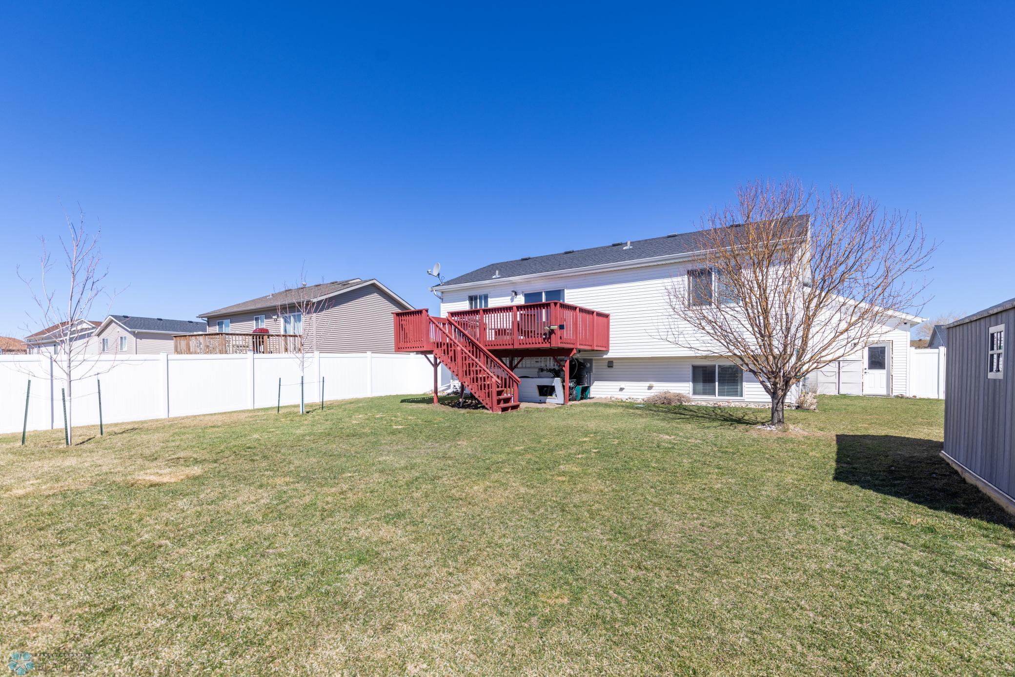 Large privately fenced yard.