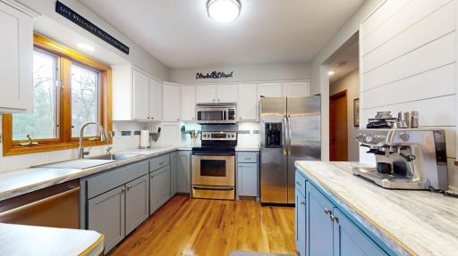 Remodeled Kitchen with hardwood floors, updated cabinets, ss appliances and tile backsplash
