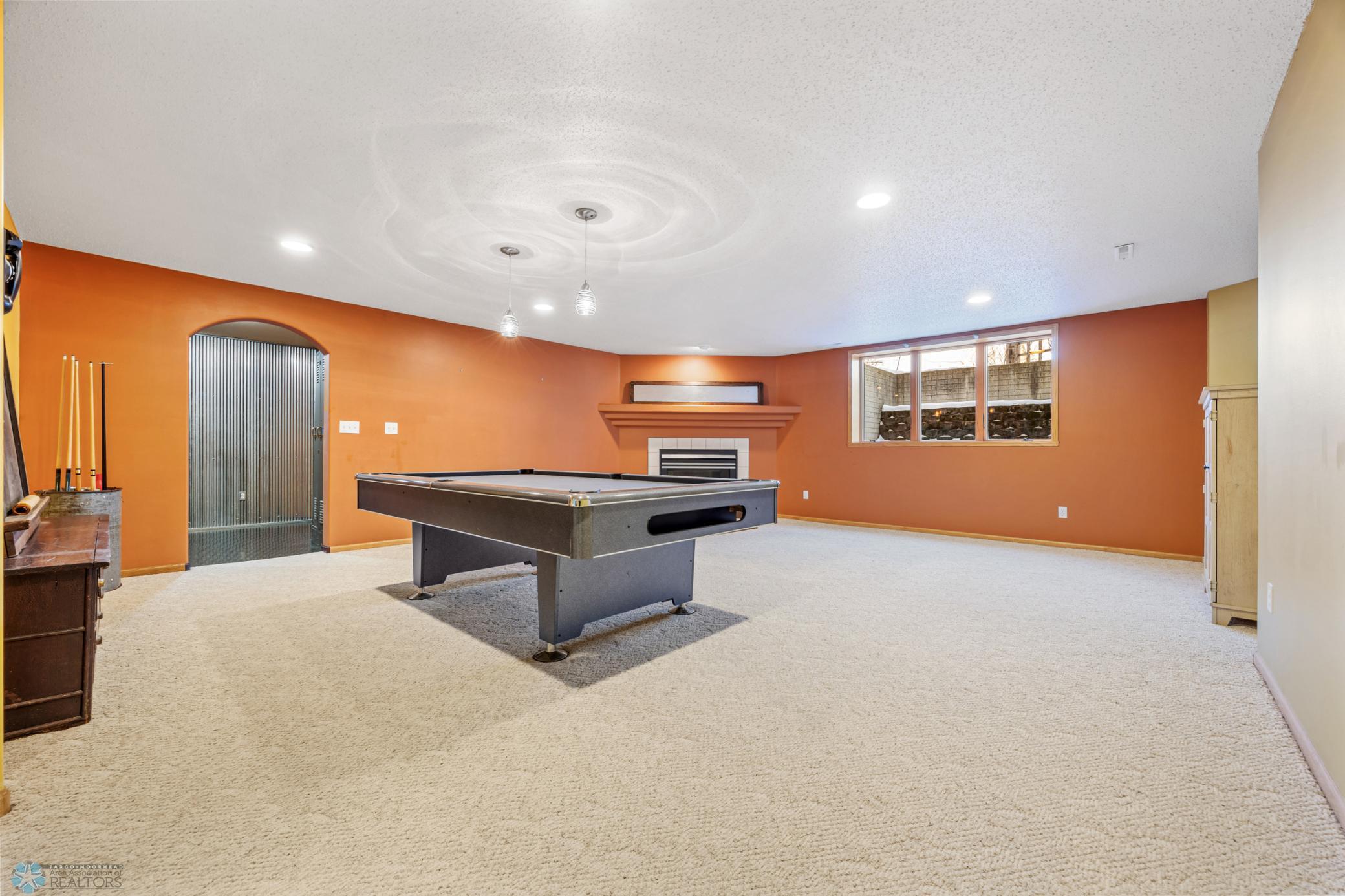 Family Room, with Game table area and gas fireplace.